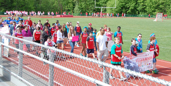 The Opening Ceremonies. The athletes and coaches from the boy's school.