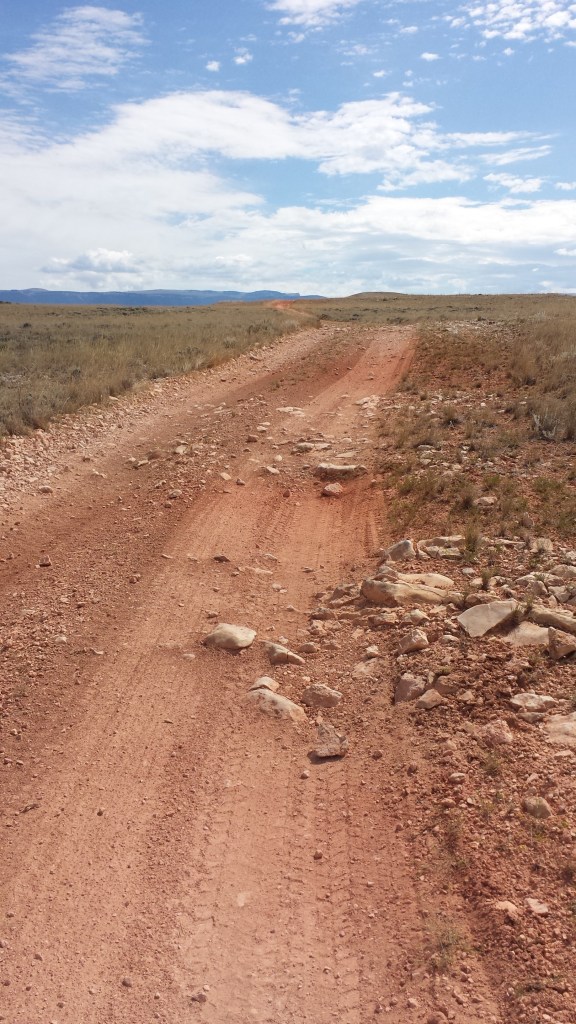 Red layers are between limestone (the blocky) layers... but no actual red rock to be seen.