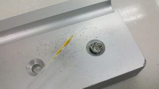 I'm using a little glass capillary tube to put the oil in the capsule.