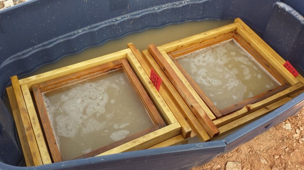 Then, agitate the screens a bit to get the clay and silt to fall off the sediments that you're interested in.