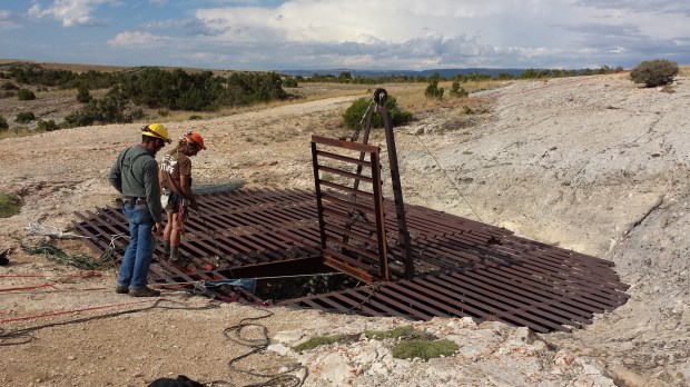 Juan and Rick wait for the next scientist to climb out of the cave.