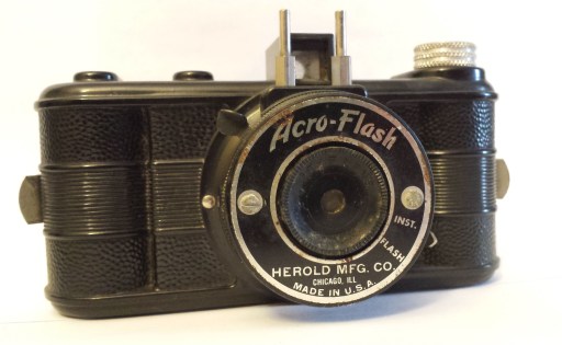 A cheap plastic point and shoot camera, called the Acro-Flash. The shutter is on the lens. There was no focusing this camera.