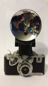 With a great-big flash unit, it was especially impressive. Plus, you get to see an inverted view of our living room and my cell phone, with which I took this photo.