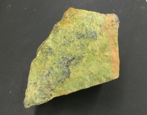 This mineral is called olivine (actually this is a rock, made up of olivine crystals). It's easy to recognise because of its pimento olive color.