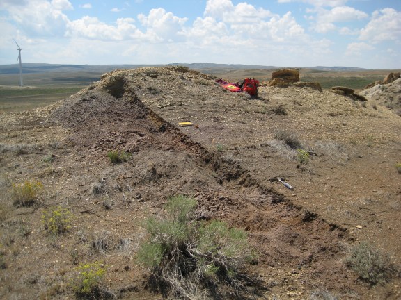 A trench dug to expose fresh rock for color analysis